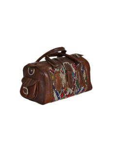 Travel bag in leather and kilim