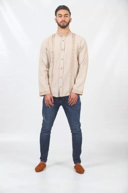 Beige shirt with orange embroidery