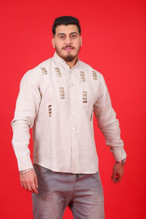 Beige printed shirt decorated with metal buttons